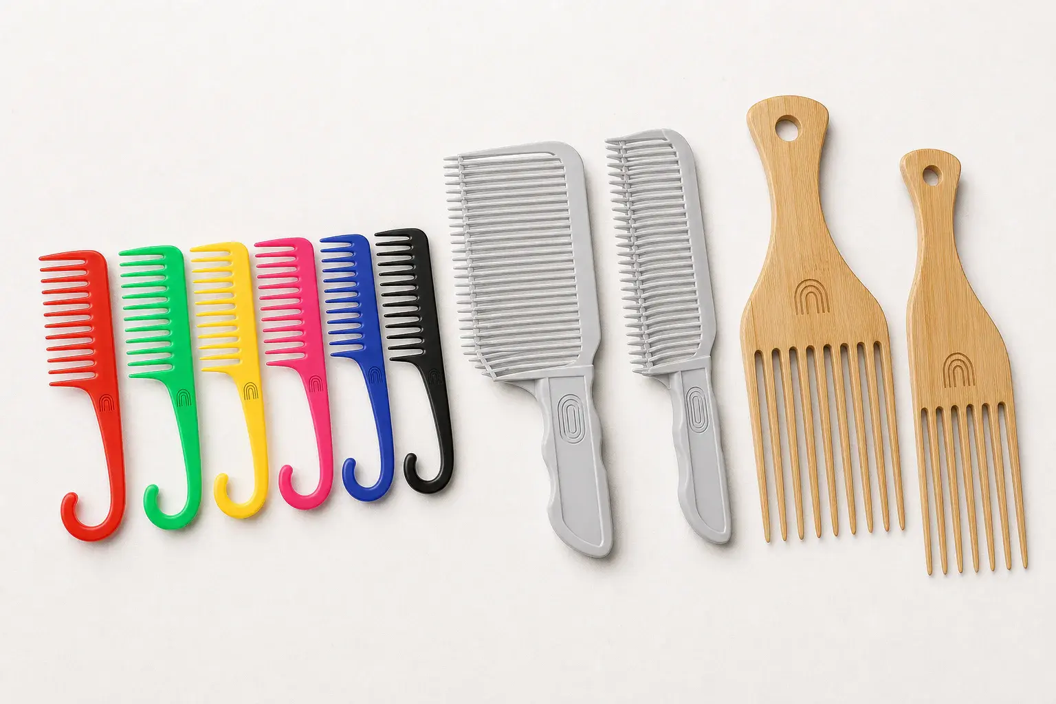 Logo placement areas compared on curved plastic, handled plastic and bamboo combs
